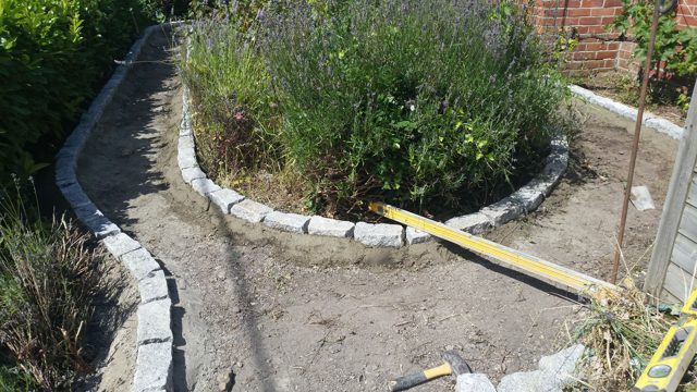 Granite setts border as a curved garden path